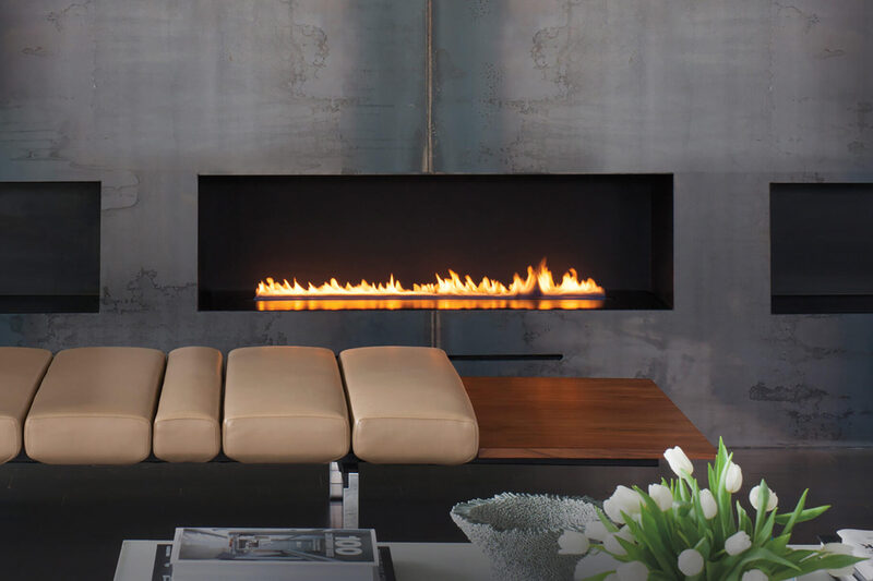A linear gas fireplace running the length of a lounge seating area.